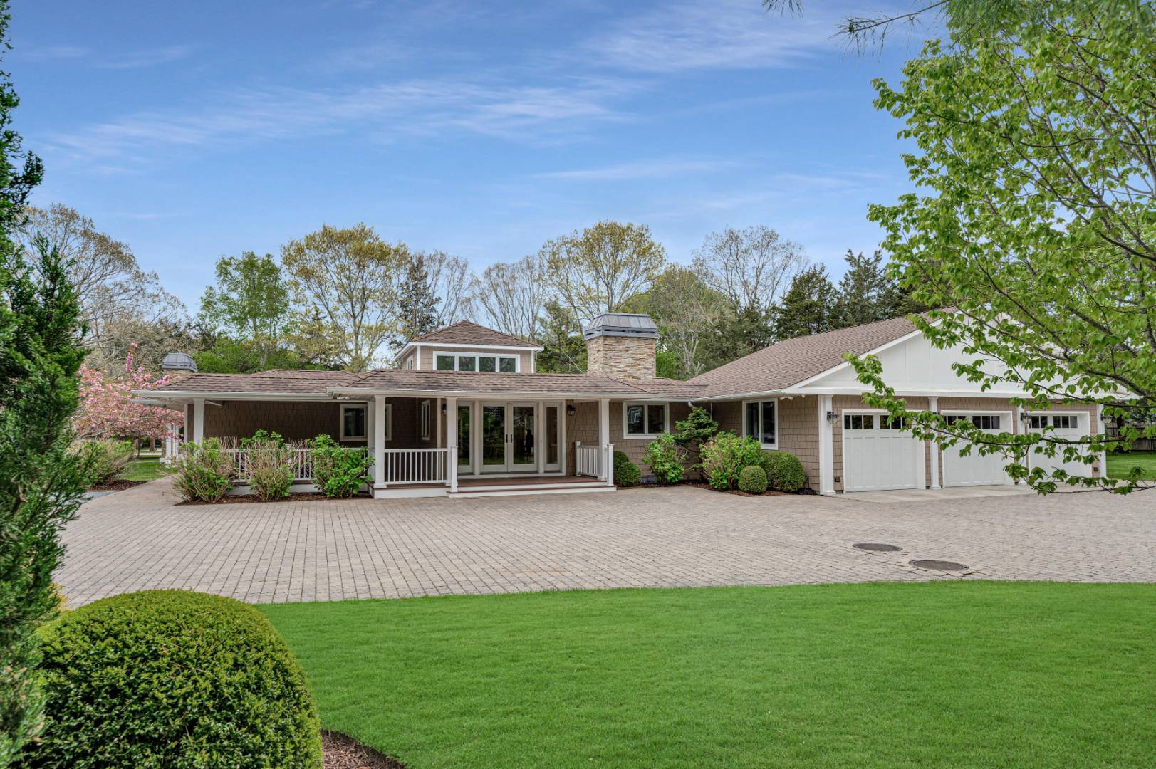 60 South Road Westhampton Beach, NY 11978 - Photo 2 of 45 front view of a house with a garden