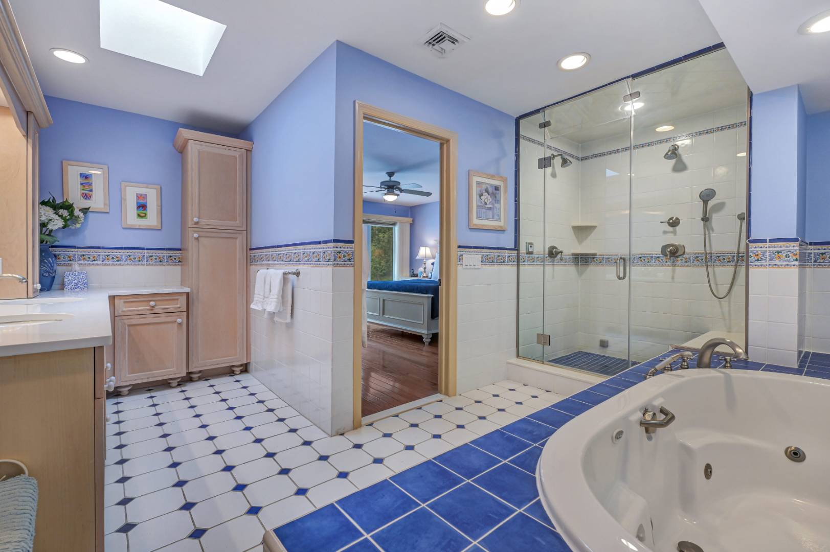 60 South Road Westhampton Beach, NY 11978 - Photo 14 of 45 a bathroom with a bathtub sink and toilet