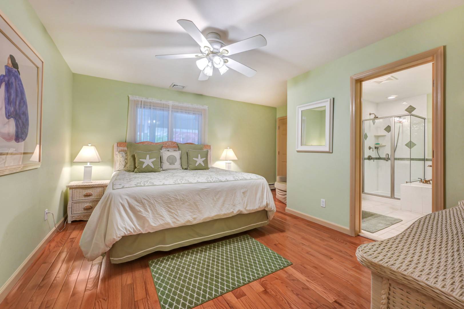 60 South Road Westhampton Beach, NY 11978 - Photo 16 of 45 a bedroom with a bed and wooden floor