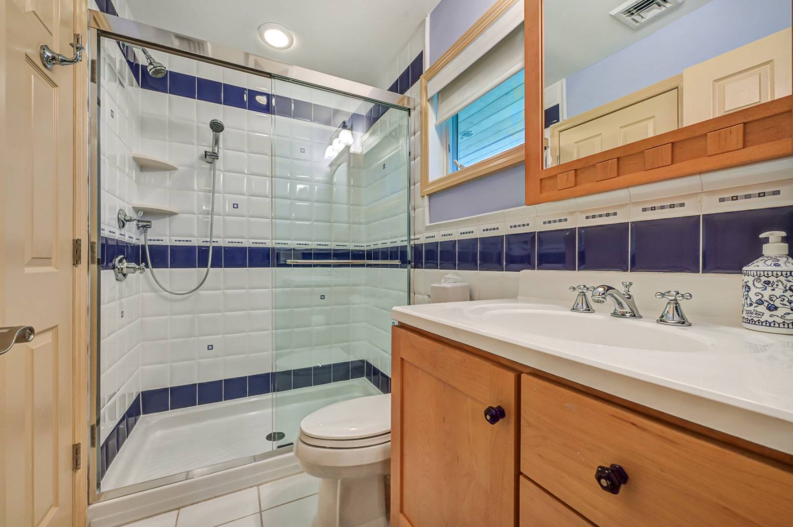 60 South Road Westhampton Beach, NY 11978 - Photo 18 of 45 a bathroom with a sink a toilet and shower