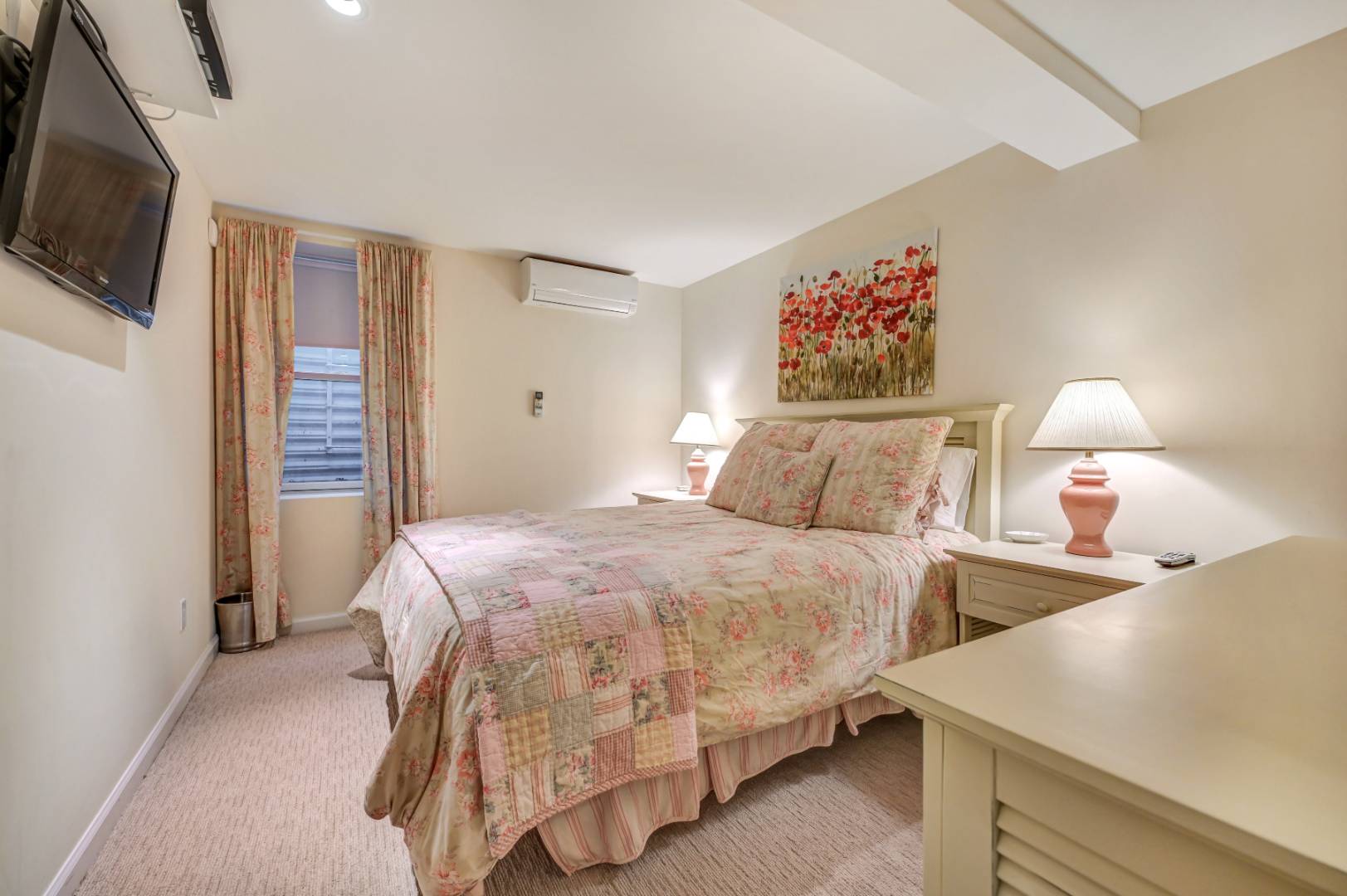 60 South Road Westhampton Beach, NY 11978 - Photo 21 of 45 a bedroom with two beds and a flat screen tv