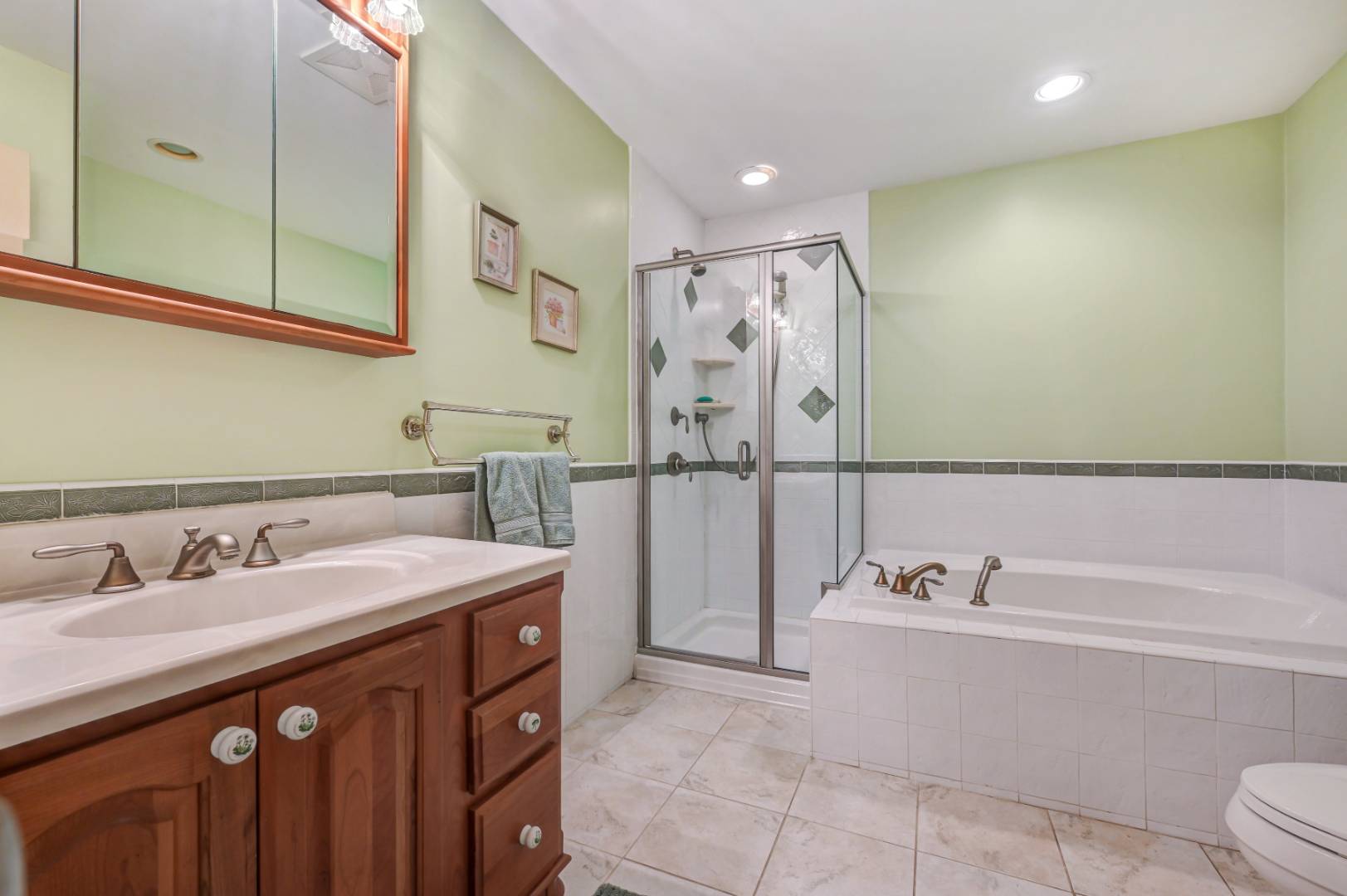 60 South Road Westhampton Beach, NY 11978 - Photo 22 of 45 a bathroom with a tub sink and mirror