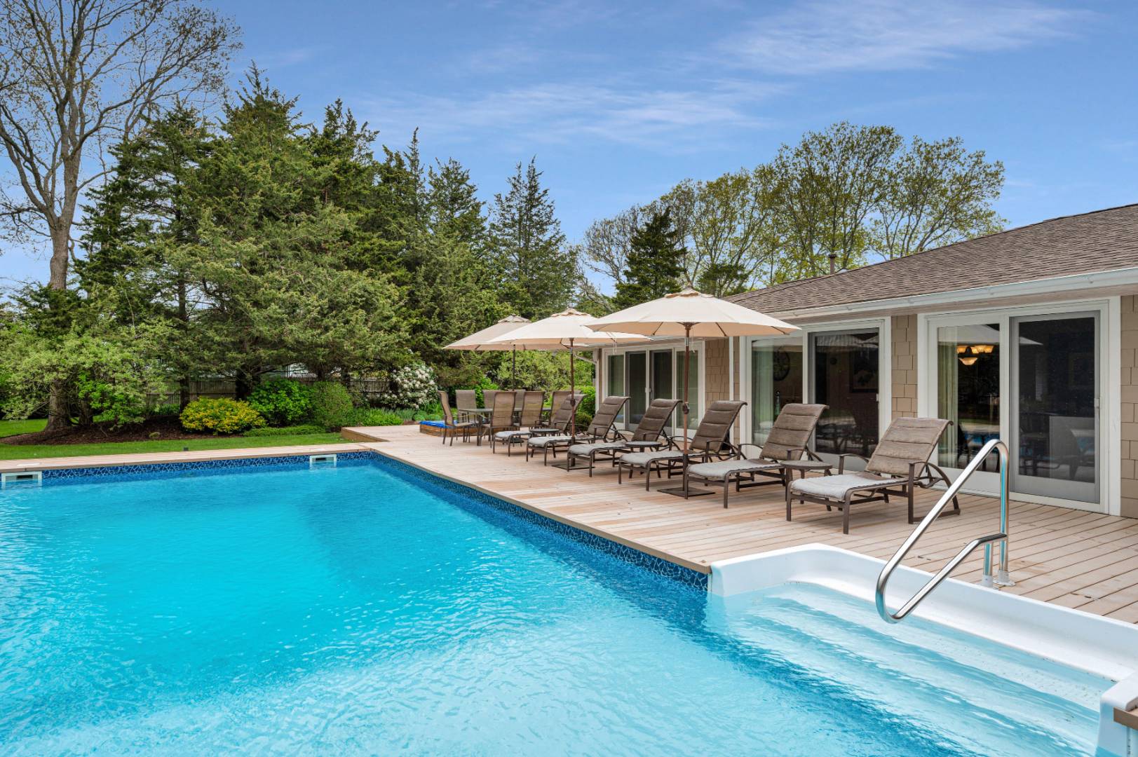 60 South Road Westhampton Beach, NY 11978 - Photo 29 of 45 a view of a house with swimming pool and sitting area