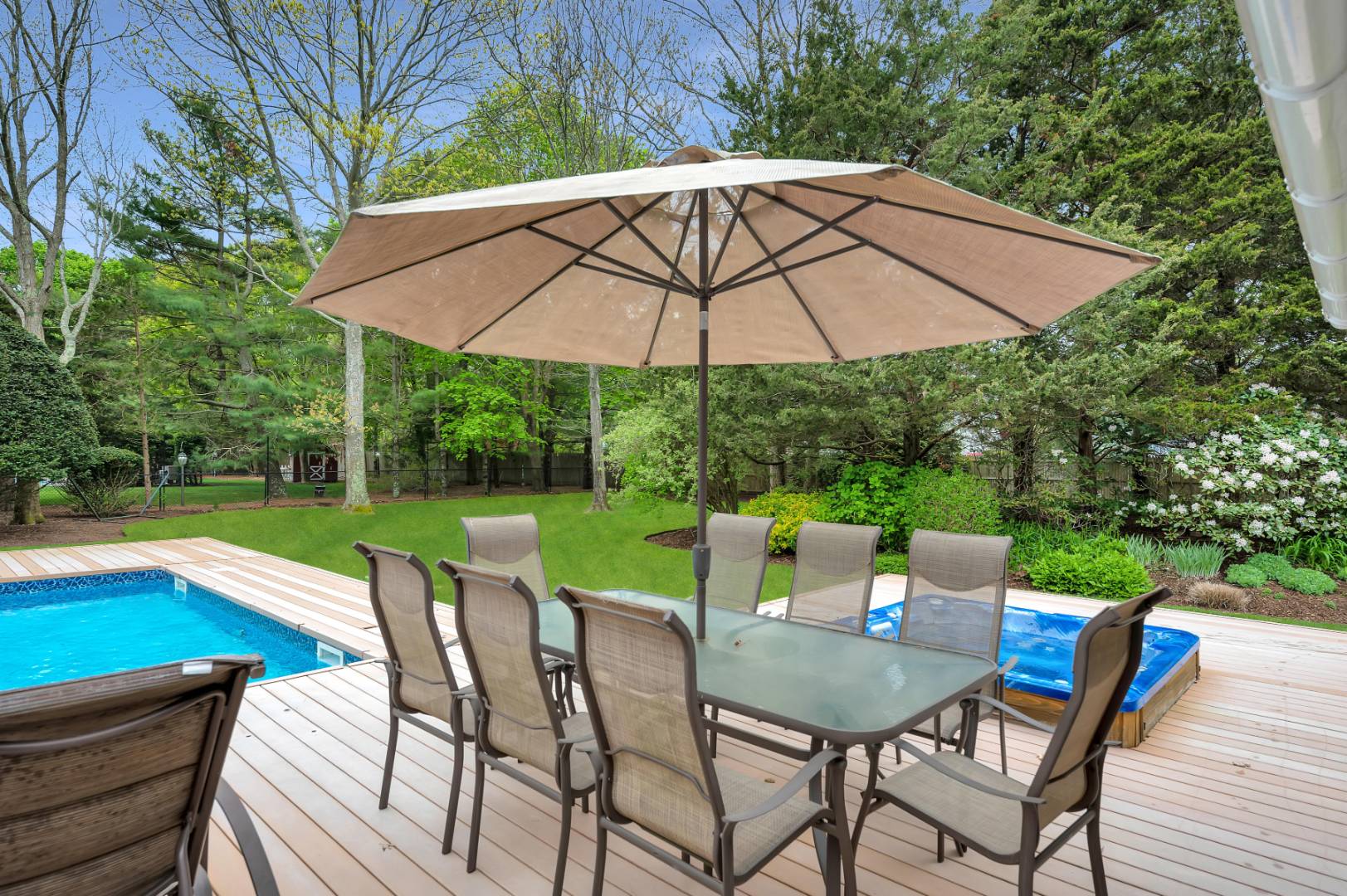 60 South Road Westhampton Beach, NY 11978 - Photo 30 of 45 a view of an outdoor sitting area with furniture and backyard