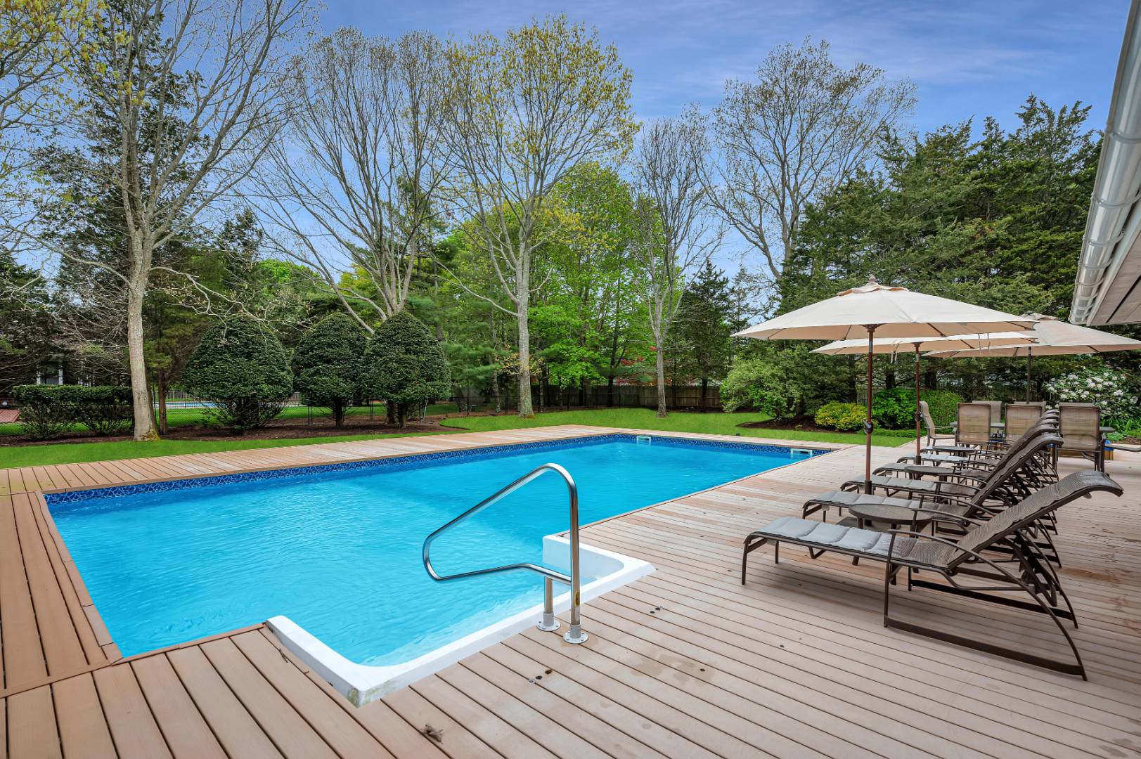 60 South Road Westhampton Beach, NY 11978 - Photo 31 of 45 a view of a swimming pool with lounge chair