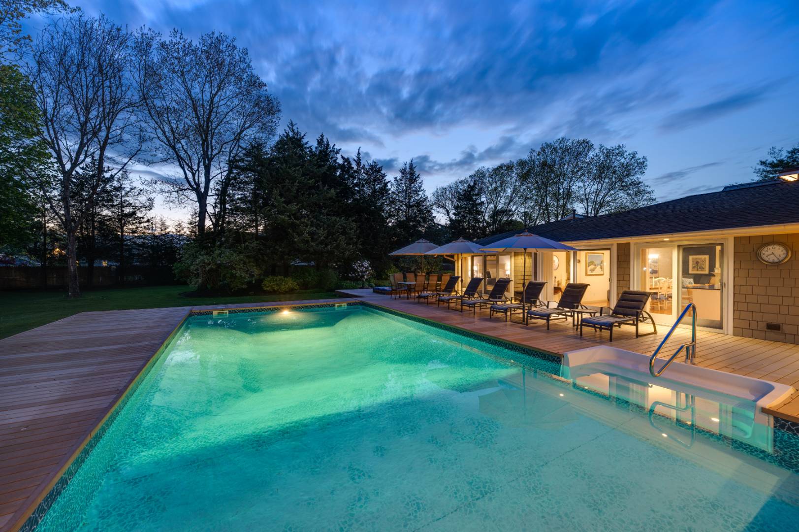 60 South Road Westhampton Beach, NY 11978 - Photo 43 of 45 a view of a house with backyard patio and a garden