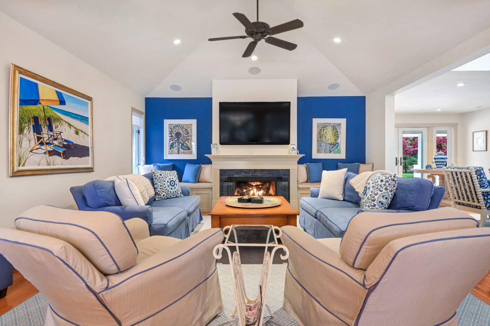 60 South Road Westhampton Beach, NY 11978 - Photo 7 of 45 a living room with furniture a flat screen tv and a fireplace