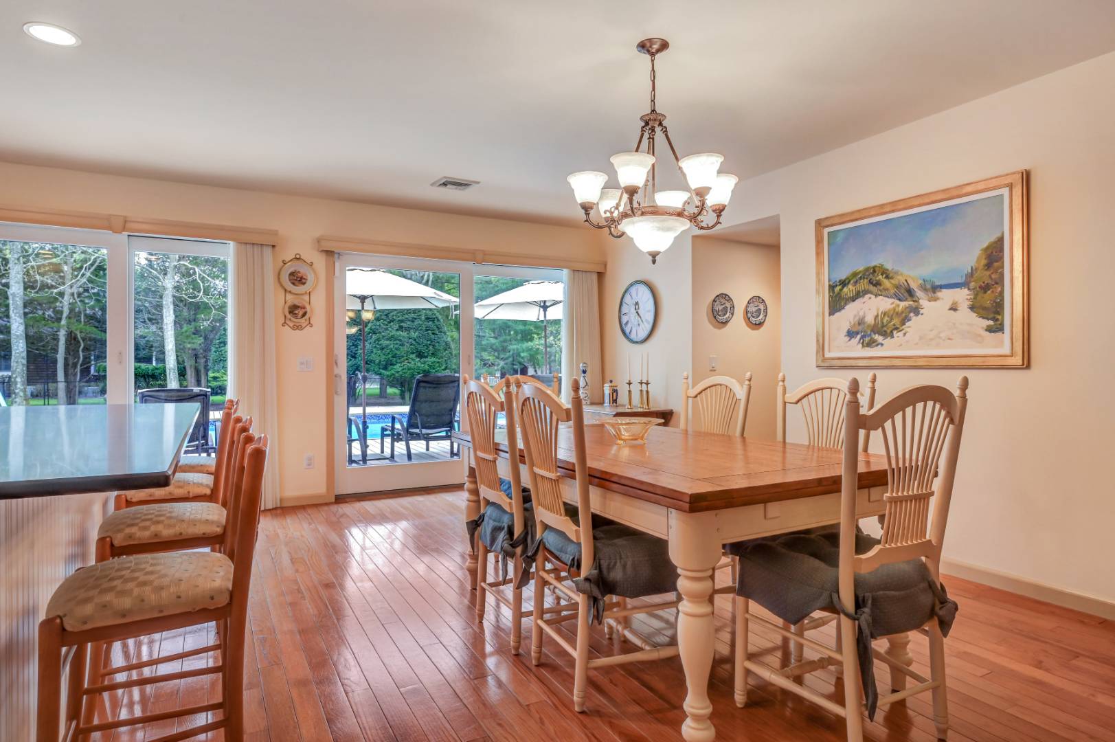 60 South Road Westhampton Beach, NY 11978 - Photo 10 of 45 a view of a dining room with furniture wooden floor and chandelier