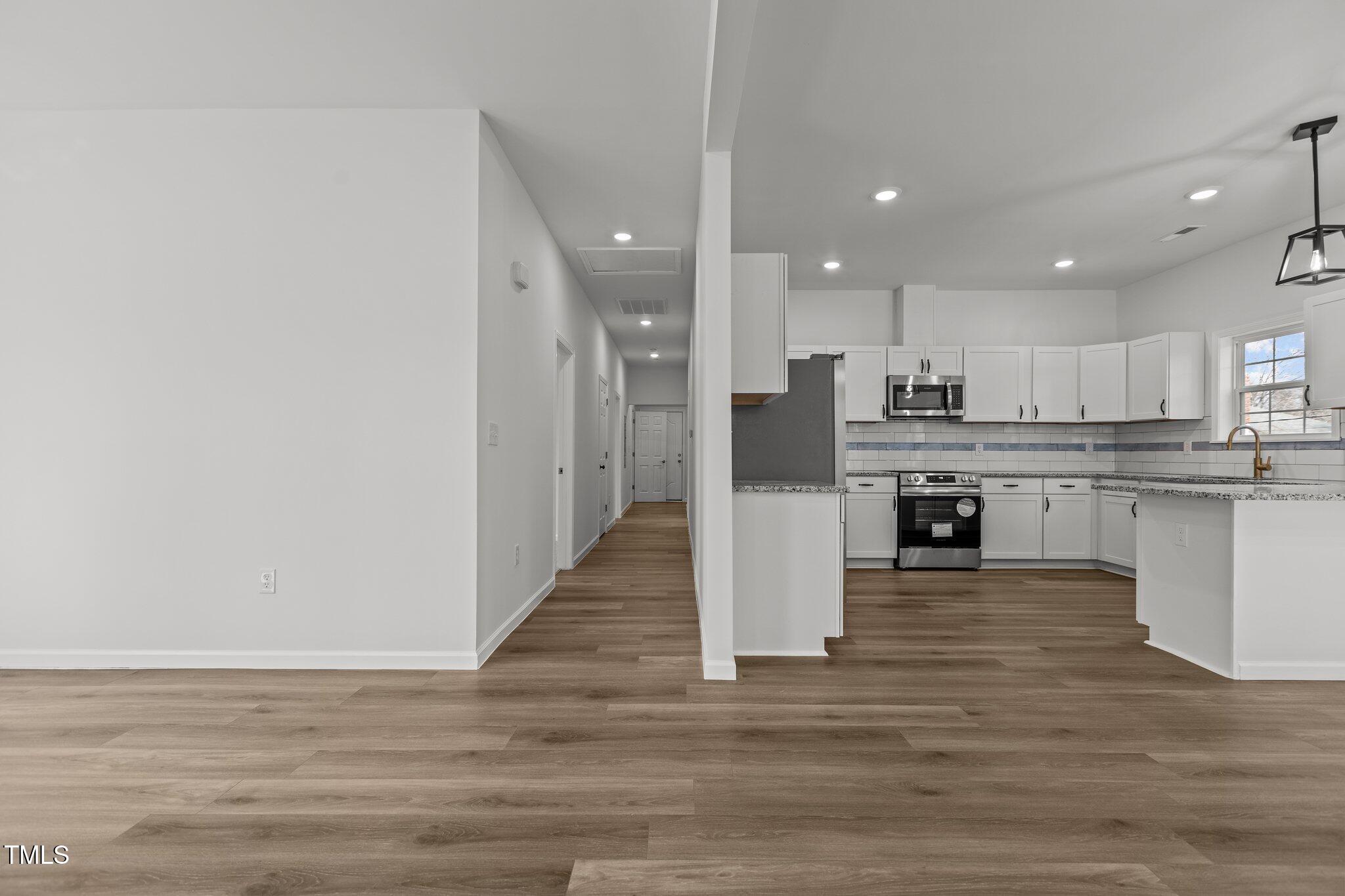 112 Edgewood Drive Roxboro, NC 27573 - Photo 18 of 37 a view of kitchen with wooden floor