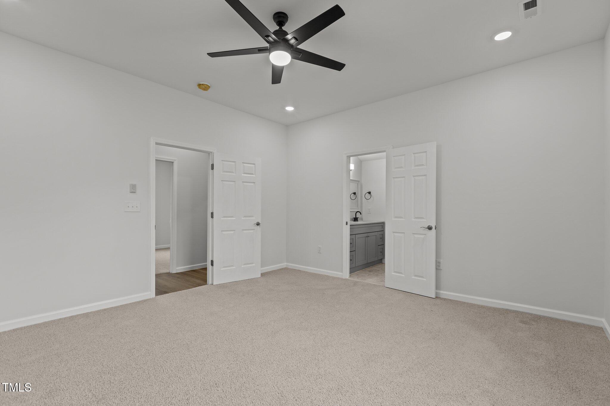 112 Edgewood Drive Roxboro, NC 27573 - Photo 20 of 37 an empty room with closet and a ceiling fan