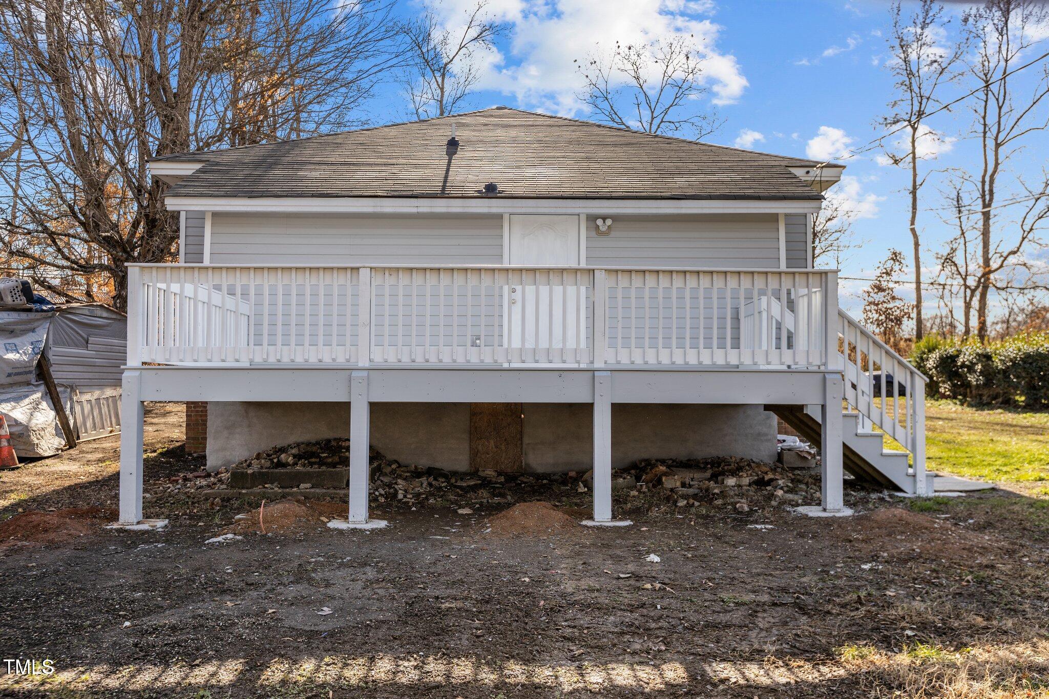 112 Edgewood Drive Roxboro, NC 27573 - Photo 30 of 37 a view of a house with a roof deck and a small cabin