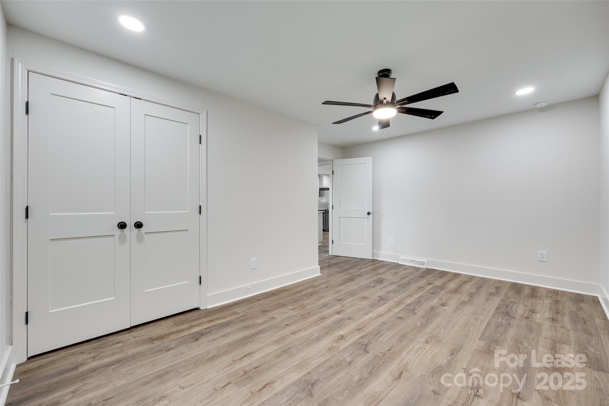 3113 E Highway, Unit 218 Monroe, NC 28110 - Photo 14 of 27 wooden floor in an empty room with a window