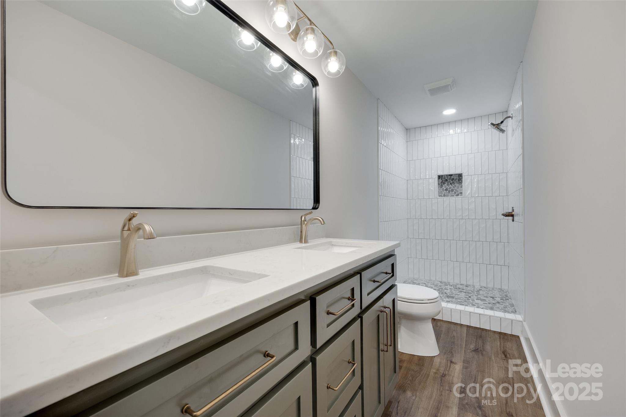 3113 E Highway, Unit 218 Monroe, NC 28110 - Photo 16 of 27 a bathroom with a sink a toilet and shower