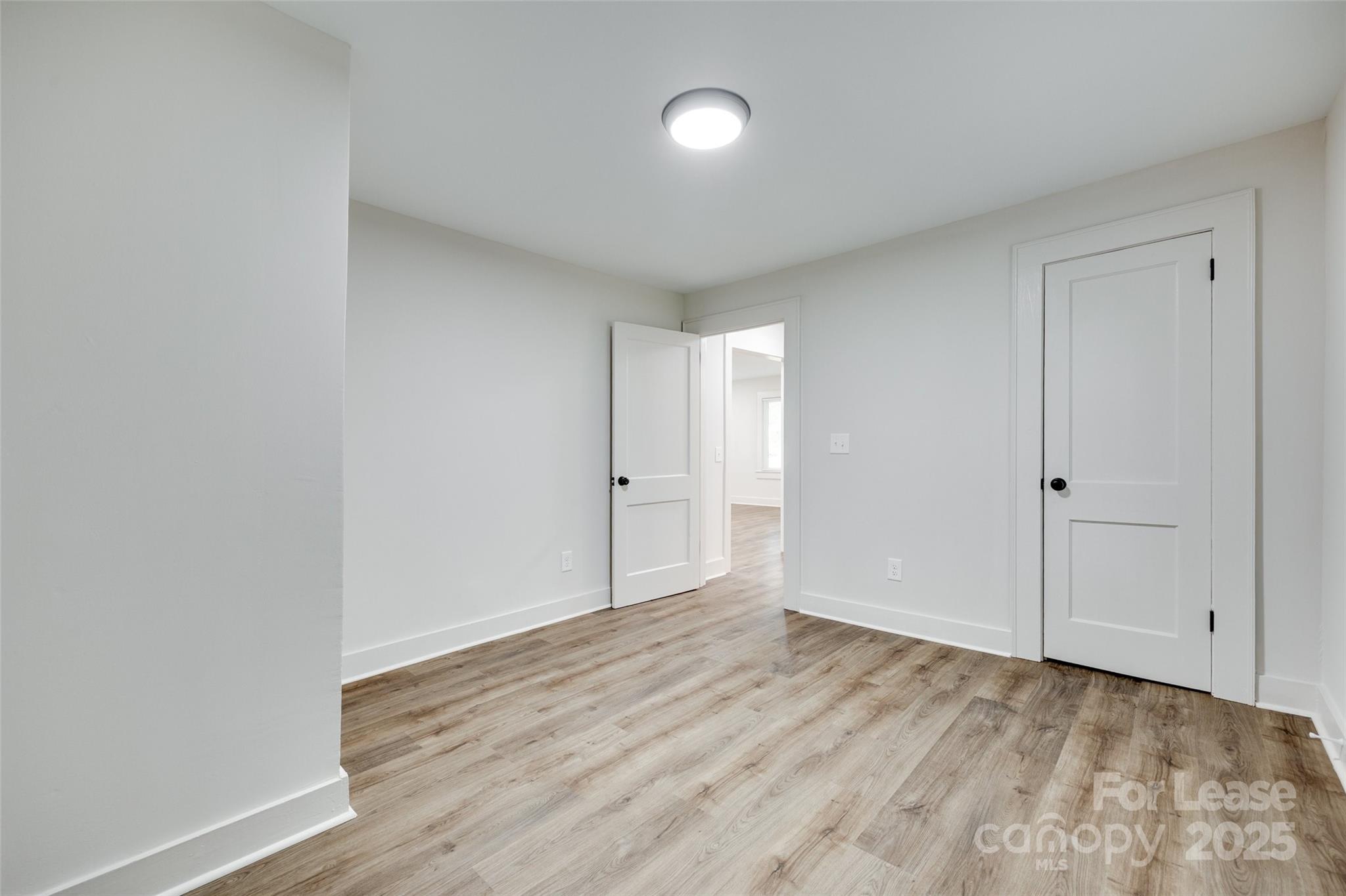 3113 E Highway, Unit 218 Monroe, NC 28110 - Photo 20 of 27 a view of an empty room and wooden floor