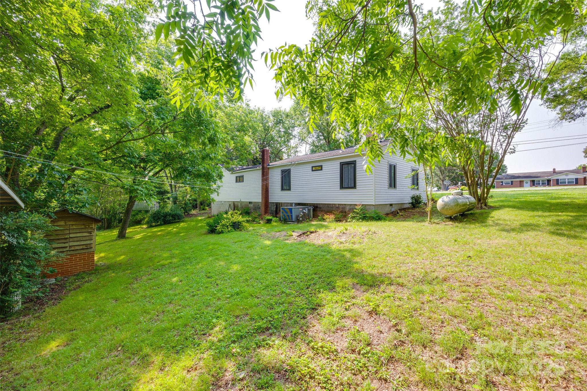 3113 E Highway, Unit 218 Monroe, NC 28110 - Photo 24 of 27 a house view with a garden space