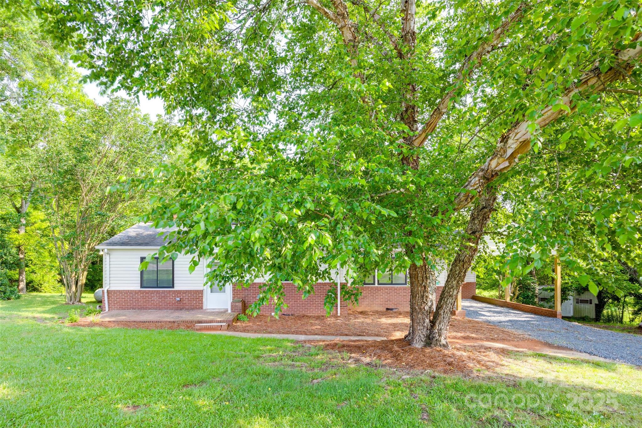 3113 E Highway, Unit 218 Monroe, NC 28110 - Photo 26 of 27 a house view with a sitting space and garden