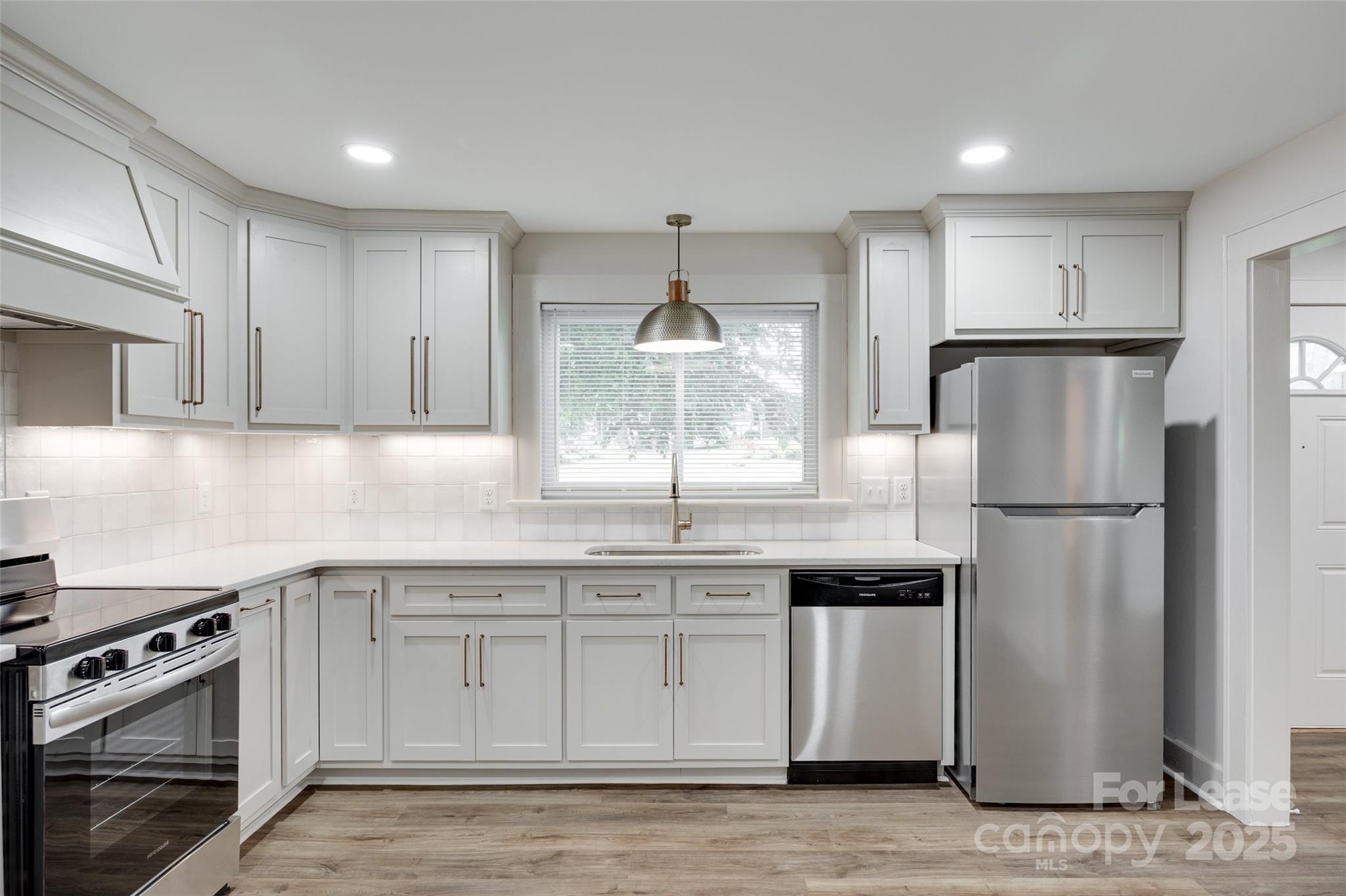 3113 E Highway, Unit 218 Monroe, NC 28110 - Photo 8 of 27 a kitchen with stainless steel appliances granite countertop a refrigerator sink and stove