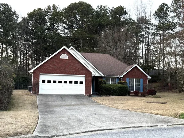 a house with trees in the background