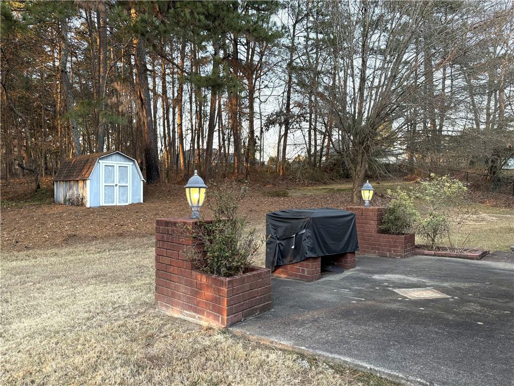 3284 Saddlegate Court Buford, GA 30519 - Photo 20 of 22 a front view of a house with a yard
