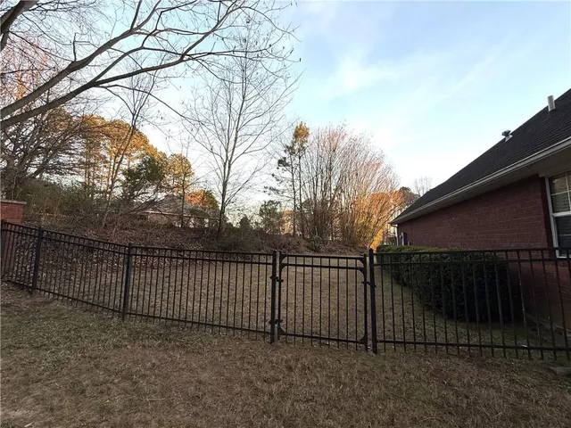 a view of a wooden fence