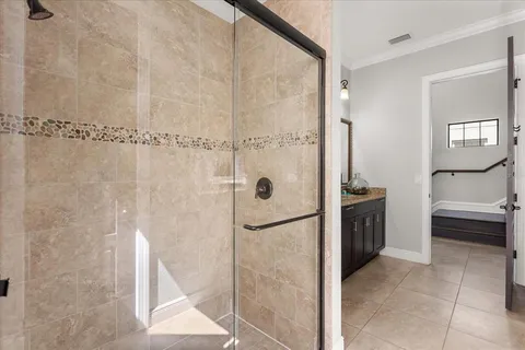 a bathroom with a shower and a sink