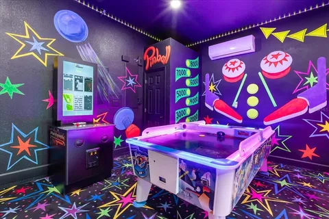 a dining room with furniture and a floor to ceiling window