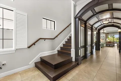 a view of entryway and hall with wooden floor