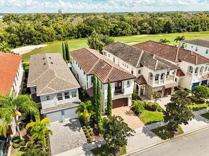 an aerial view of residential houses with outdoor space
