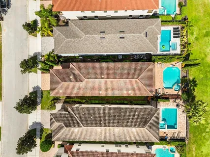 an aerial view of a house with a ocean view