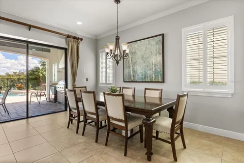a view of a dining room with furniture and window