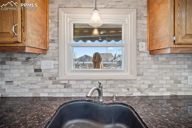 a kitchen with stainless steel appliances granite countertop a refrigerator sink and cabinets