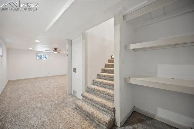 a view of empty room with a fireplace