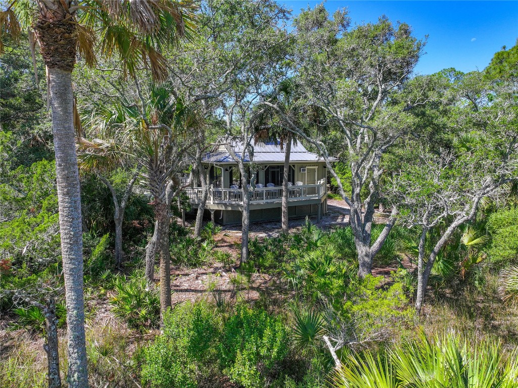 96198 Brady Point Road Fernandina Beach, FL 32034 - Photo 17 of 18 front view of a house with a garden