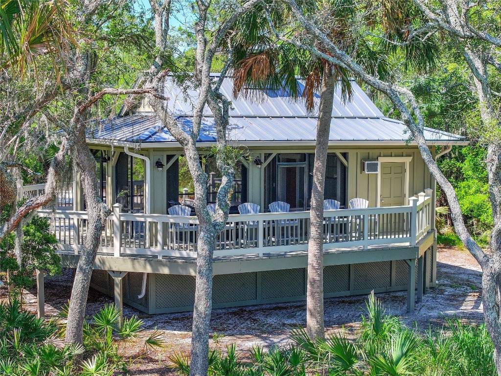 96198 Brady Point Road Fernandina Beach, FL 32034 - Photo 18 of 18 a view of a patio with table and chairs potted plants and large tree