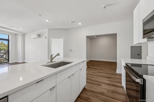 a kitchen with a sink and cabinets