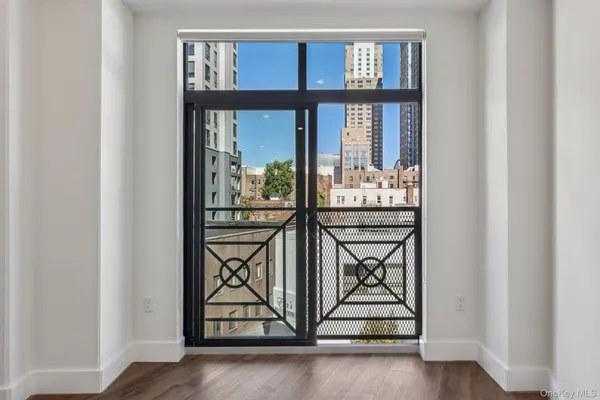 a view of a entryway door with wooden floor
