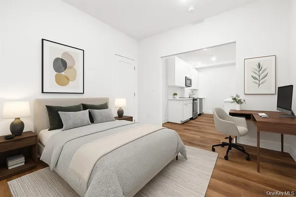 a bedroom with a bed and a desk