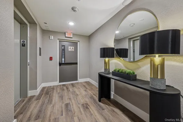 a bedroom with stainless steel appliances kitchen island a refrigerator sink and stove