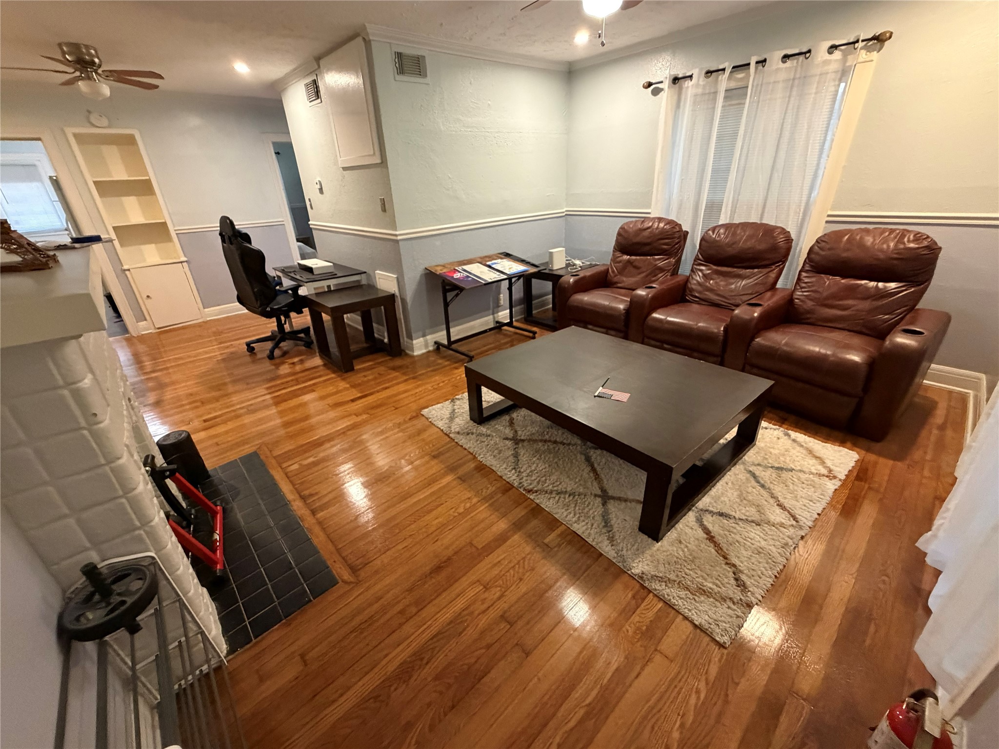 1109 Autrey Street, Unit 1 Houston, TX 77006 - Photo 3 of 28 Large Family Room with wood floors - all furniture included is optional.