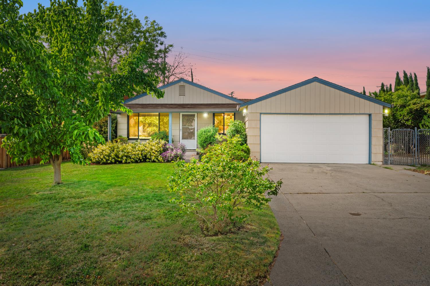 7131 Sunset Avenue Fair Oaks, CA 95628 - Photo 1 of 1 a front view of a house with a yard and garage