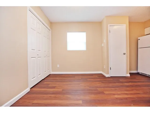 a sign that is sitting on a wooden floor