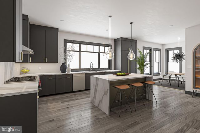 a kitchen with a table chairs stove and wooden floor