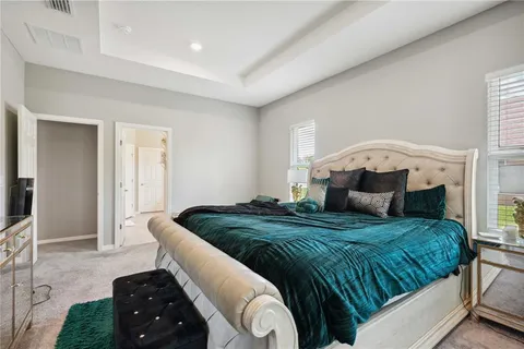 a living room with a bed and furniture