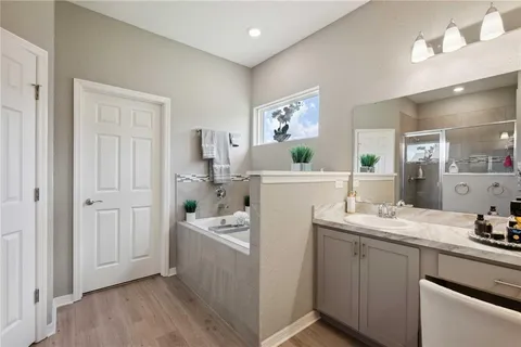 a bath tub sitting next to a white sink