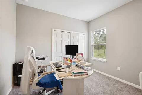 a bedroom with a bed and a tv