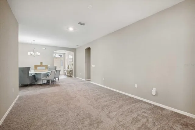 a view of a livingroom with a dinning table and a couch