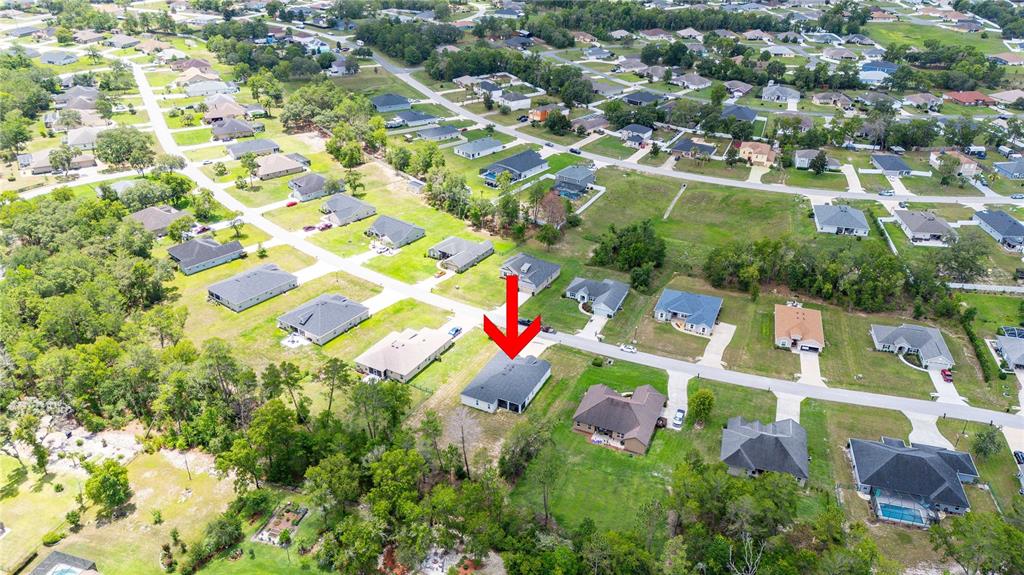 5239 Southwest 114th Street Road Ocala, FL 34476 - Photo 42 of 42 an aerial view of residential houses with outdoor space and trees