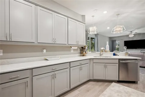 a kitchen with a sink and cabinets