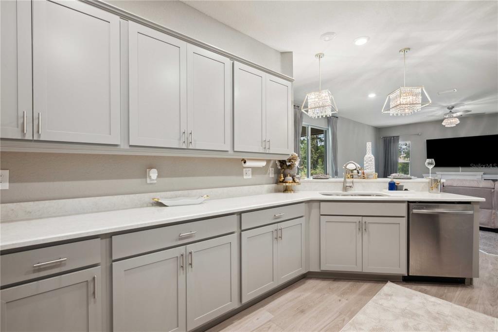 5239 Southwest 114th Street Road Ocala, FL 34476 - Photo 10 of 42 a kitchen with a sink and cabinets