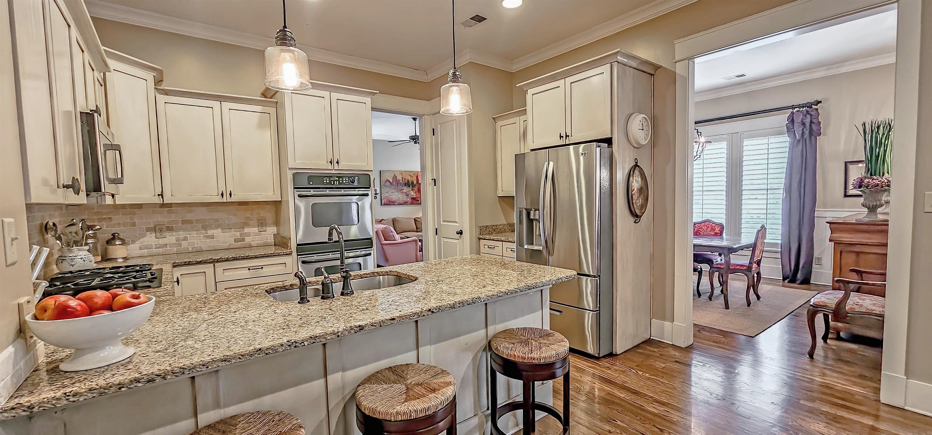1784 Penshurst Drive Collierville, TN 38017 - Photo 14 of 40 a kitchen with stainless steel appliances granite countertop a sink refrigerator and cabinets